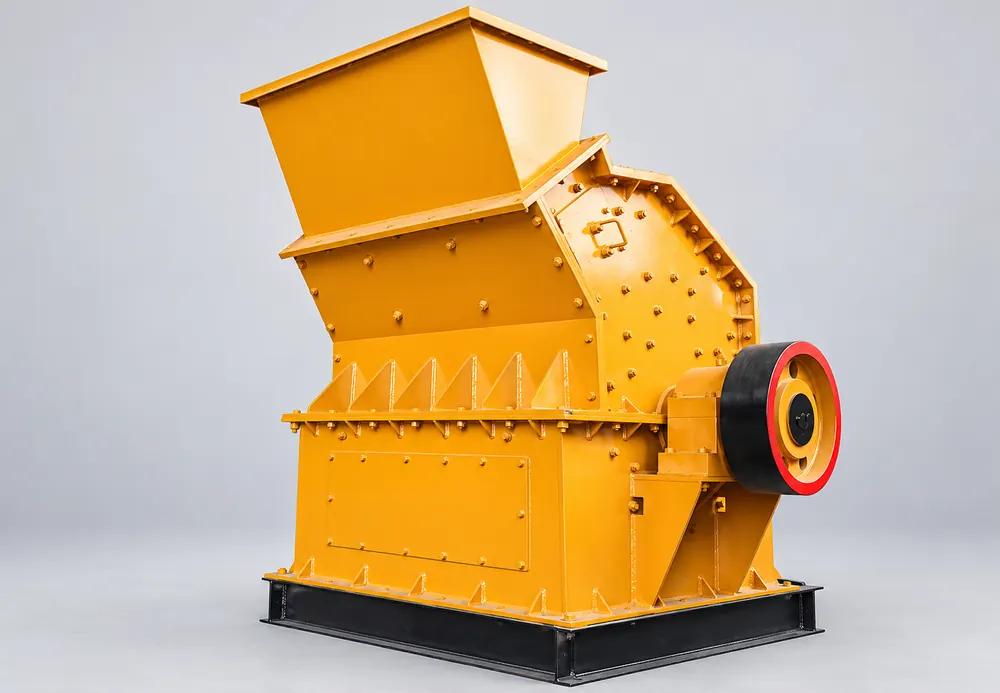 Yellow fine crusher with a rectangular top hopper, bolted housing, and side pulley