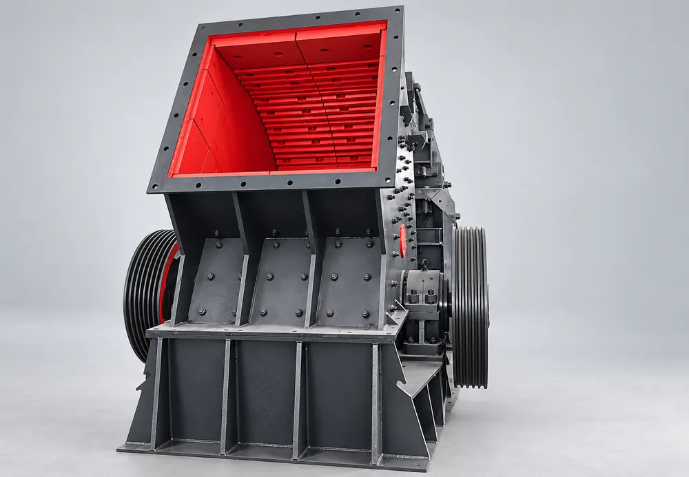 Dark gray heavy hammer crusher with a red-lined inlet and large side pulleys
