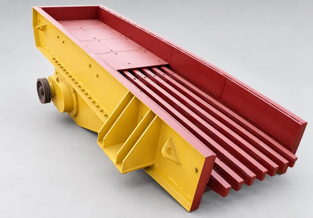 Yellow vibrating feeder with red inner sidewalls, a solid feed pan, and exposed grizzly bars